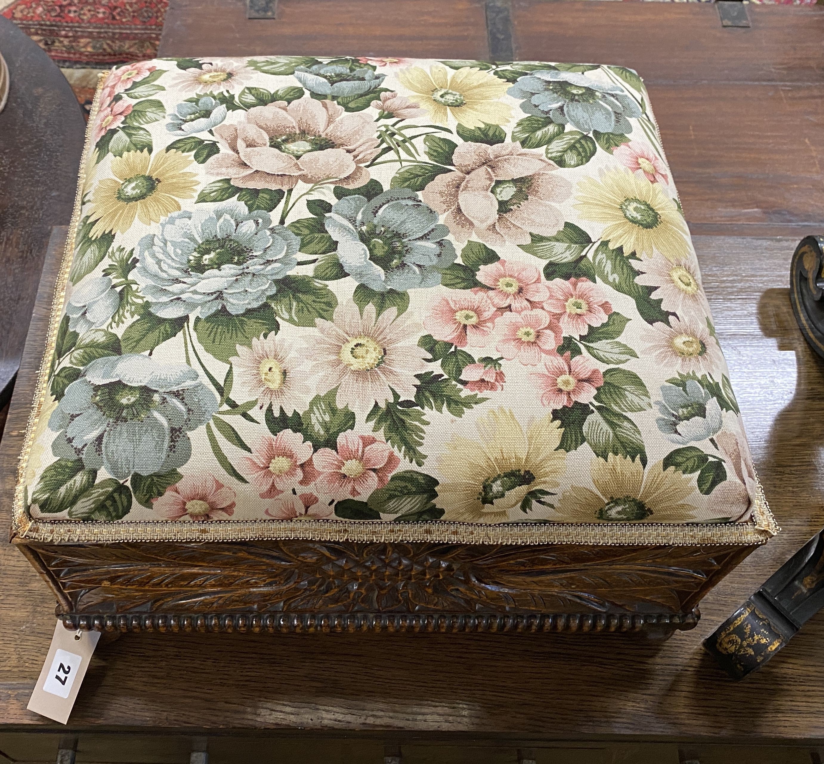 An early 20th century rectangular carved oak footstool, length 46cm, depth 42cm, height 26cm